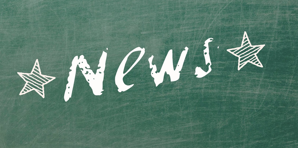 Green chalkboard on which is written the word News with white chalk, framed with two white stars